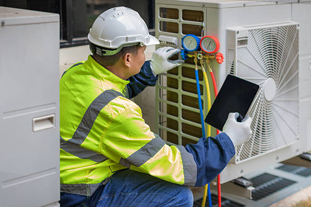 Professional Heat Pump Repair technician working in Monroe, IN